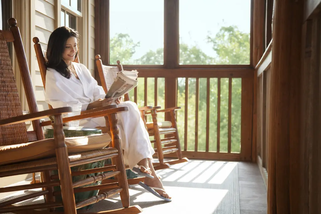 The JFK rockers on the Lake House porch provide serene moments overlooking the resort.  (Photo by Lake Austin Spa Resort)