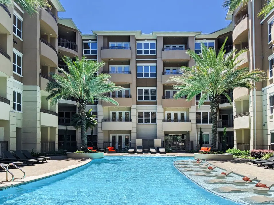 The resort-style pool and courtyard at Tuscany Walk Apartments.