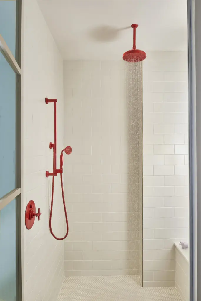 Red plumbing fixtures in the bath rooms carry out the Virgin Hotels color theme.  