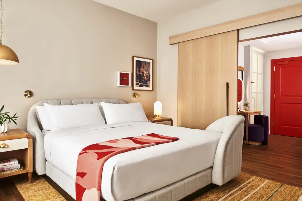 The Chambers guest rooms are residential-inspired retreats. Swoon, the Studio, created an urban oasis incorporating Moroccan-style tile, natural-stone countertops, white oak millwork, sheer cream linen drapery, tactile flannel wallcoverings, sculptural brass lighting, and crisp white cotton bedding.

Red shower fixtures, red velvet Vladimir Kagan-inspired sofas, and red-and-blush throw blankets custom-designed and illustrated by Swoon give the rooms playfulness. 