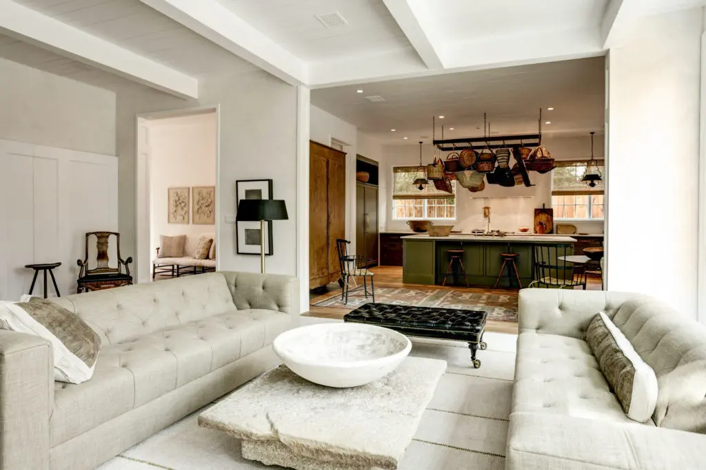 A fresh modern take on a classic kitchen design with island seating, easy access built in cabinetry, honed calacatta counters, and huge built in refrigerator, designed Shannon Bowers.