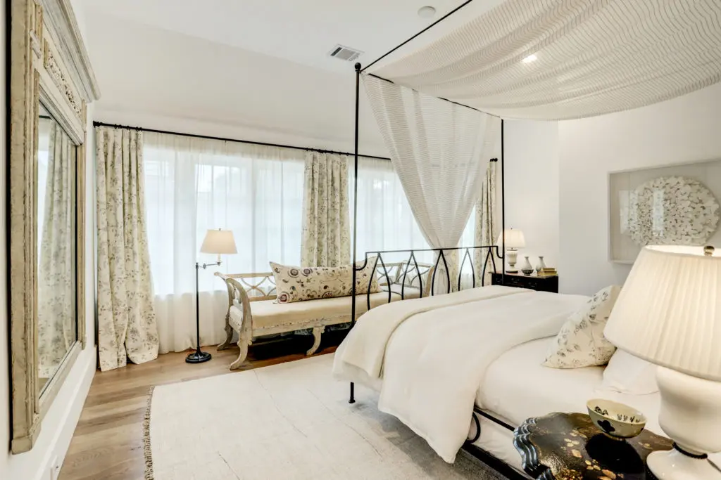 Secondary Bedroom (designed by Kathryn Ireland) with great natural light, hardwood floors, ensuite bath, and a huge walk in closet.