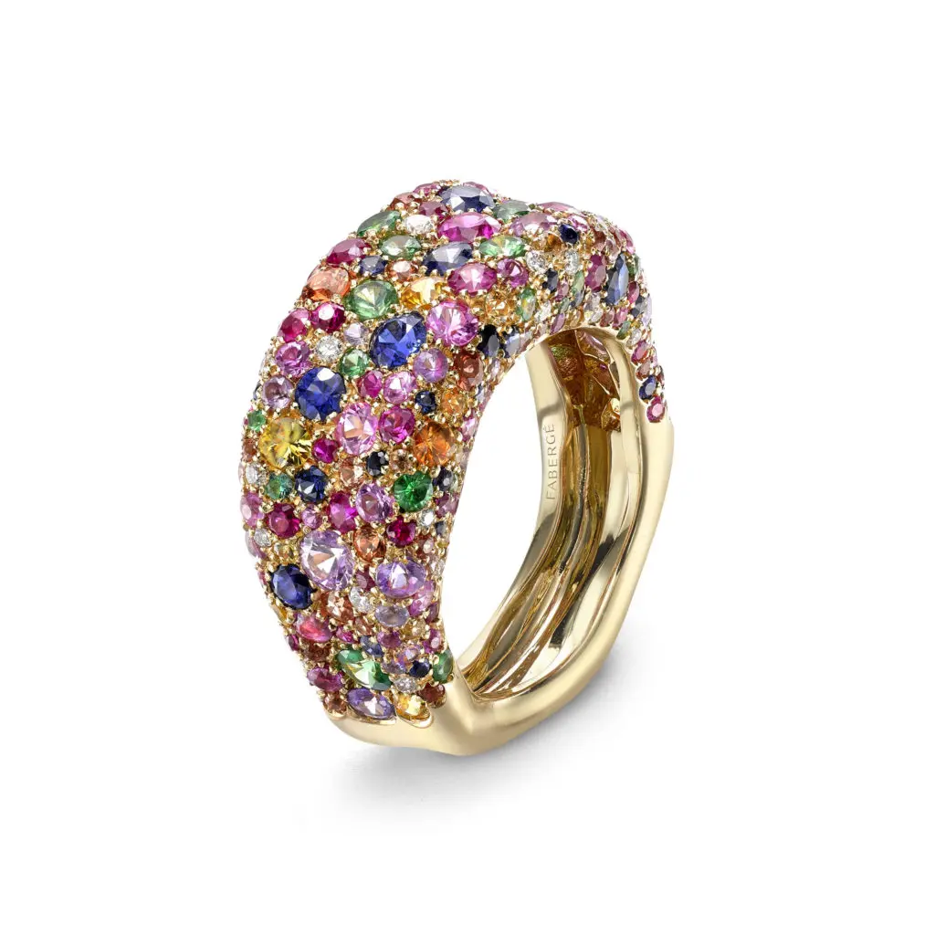 Emotion multi-colored cluster ring encrusted with sapphires, white diamonds, rubies, tsavorites and emeralds, set in 18 karat yellow gold.