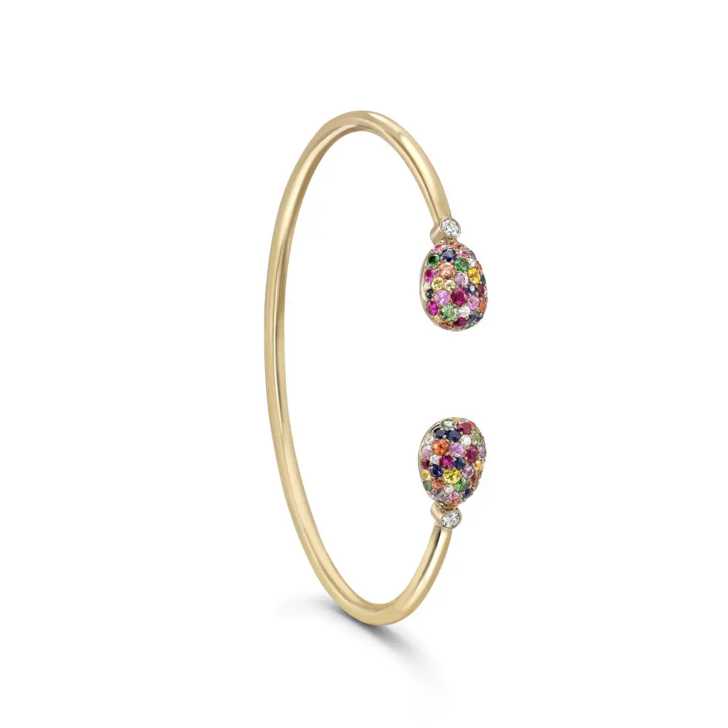 The Emotion yellow gold open bracelet features an intensely colorful collection of 50 pavé-set multi-colored stones.