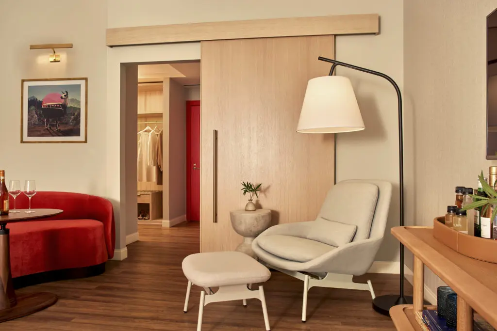 In the Grand Chamber suite, splashes of red liven Swoon's calm palette of mid-century inspired furnishings and natural materials like oak, leather, and concrete.  
