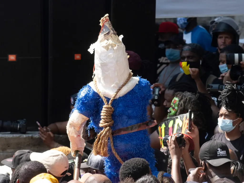 A figure of a police figure with a rope around its neck was brought to the Houston March For George Floyd. (Photo by F. Carter Smith)