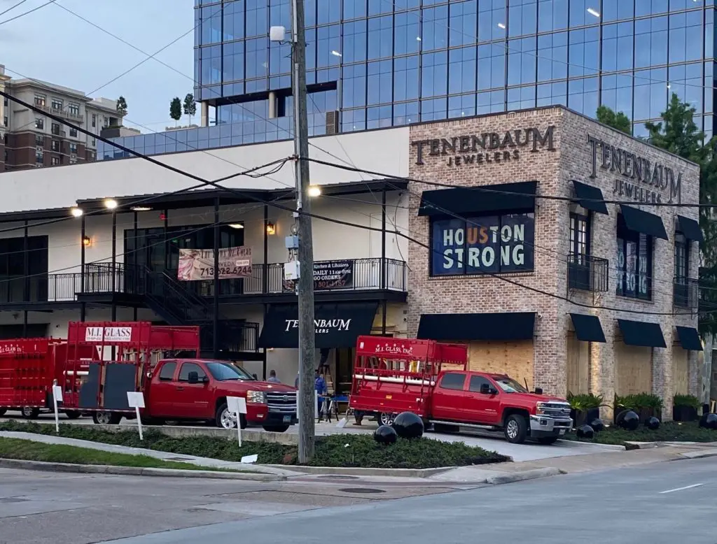 Late Monday, Tenenbaum Jewelers boards up after a window was smashed late Sunday night.  (Photo by Tony Bradfield)
