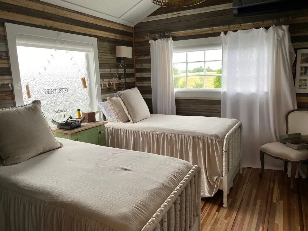 The silo bedroom is carved from wood salvaged from area homes, weathered bead board, sheet metal and even antique window frames.  (Photo by Shafik I. Rifaat)