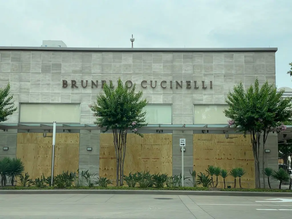 With merchandise removed from sight, Brunello Cucinelli in River Oaks District boards up. (Photo by Shelby Hodge)
