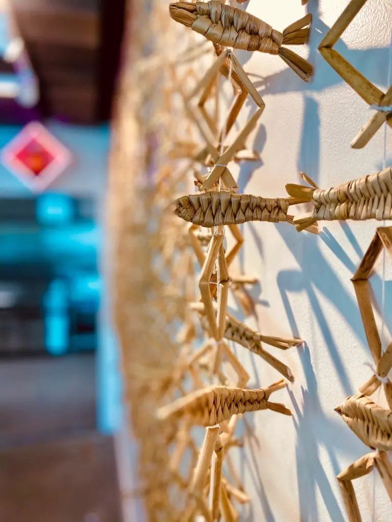 Woven fish line the walls and cast an artistic shadow at Museo II. (Rosalia Ramirez Antonio).