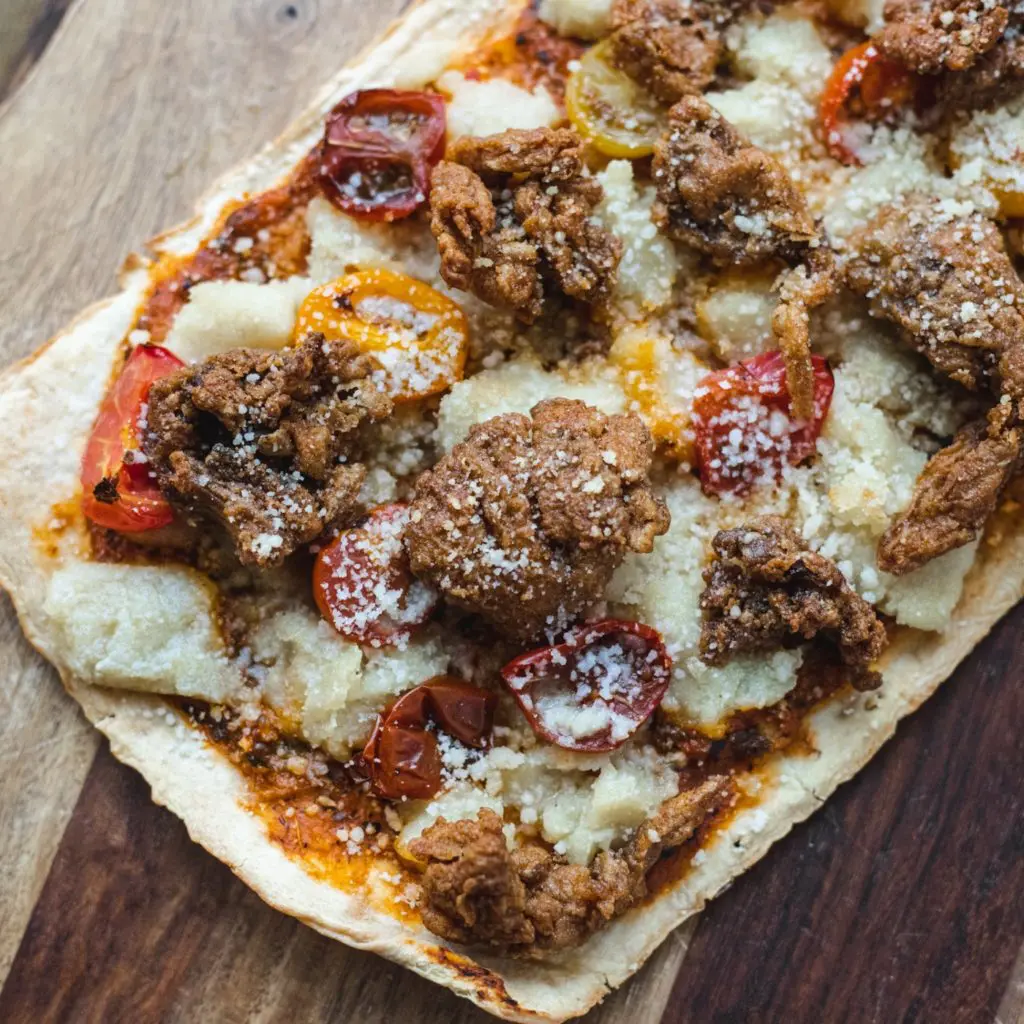 The Impossible Italian Sausage and Mushroom Pizza at TLC Vegan Kitchen is our favorite.
