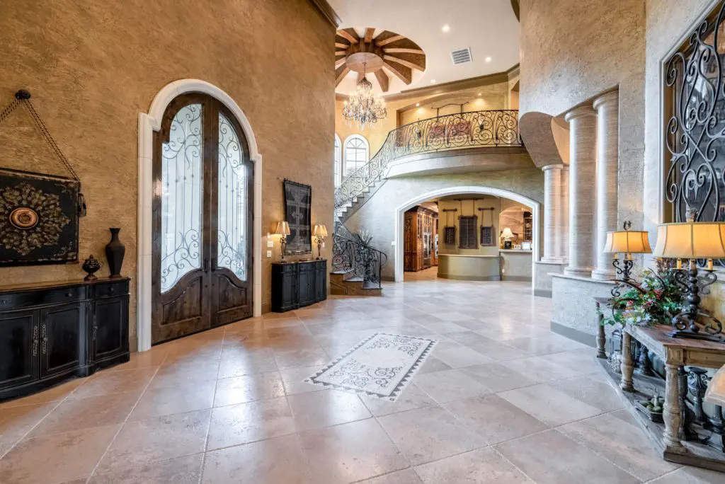 The dramatic entry hall with travertine under foot. 