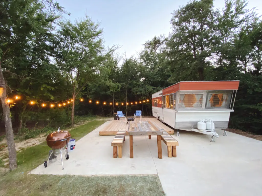 Every vintage trailer rental comes with its own deck and Weber charcoal grill.