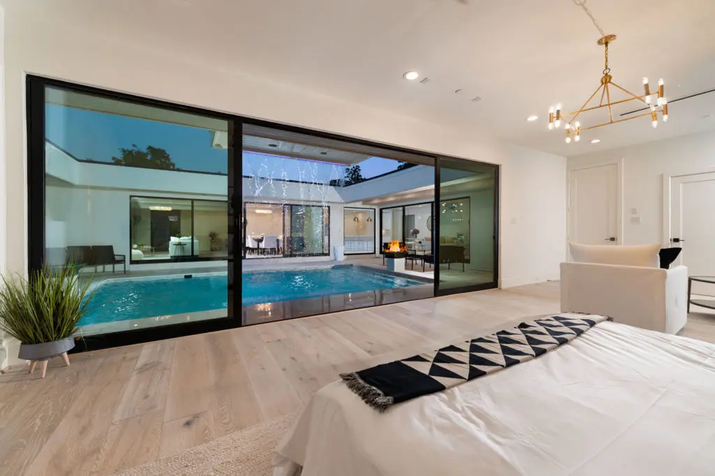 Primary bedroom view to central pool.