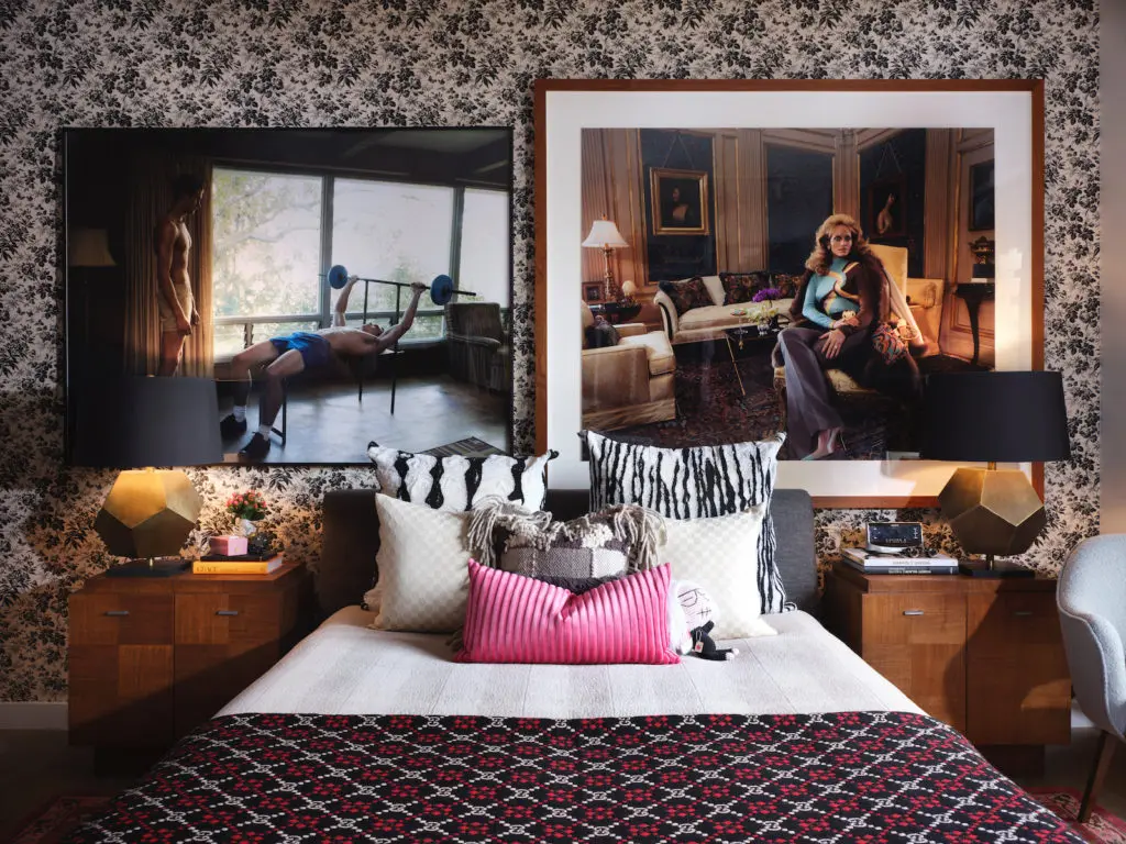 In this bedroom in a private home, Luke Smalley’s Exercise at Home, from Clamp Art, NYC. Steven Meisel’s Versace Pictures, acquired at auction. (Photo by Lisa Petrole)