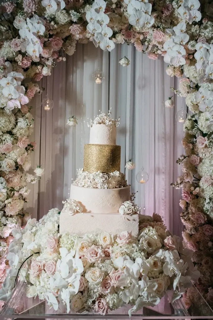 Even in a pandemic, a bride can have her wedding cake for an unveiling, then later served according to health protocols.(Photo by Composure Studios for Grayhouse Events Atelier)