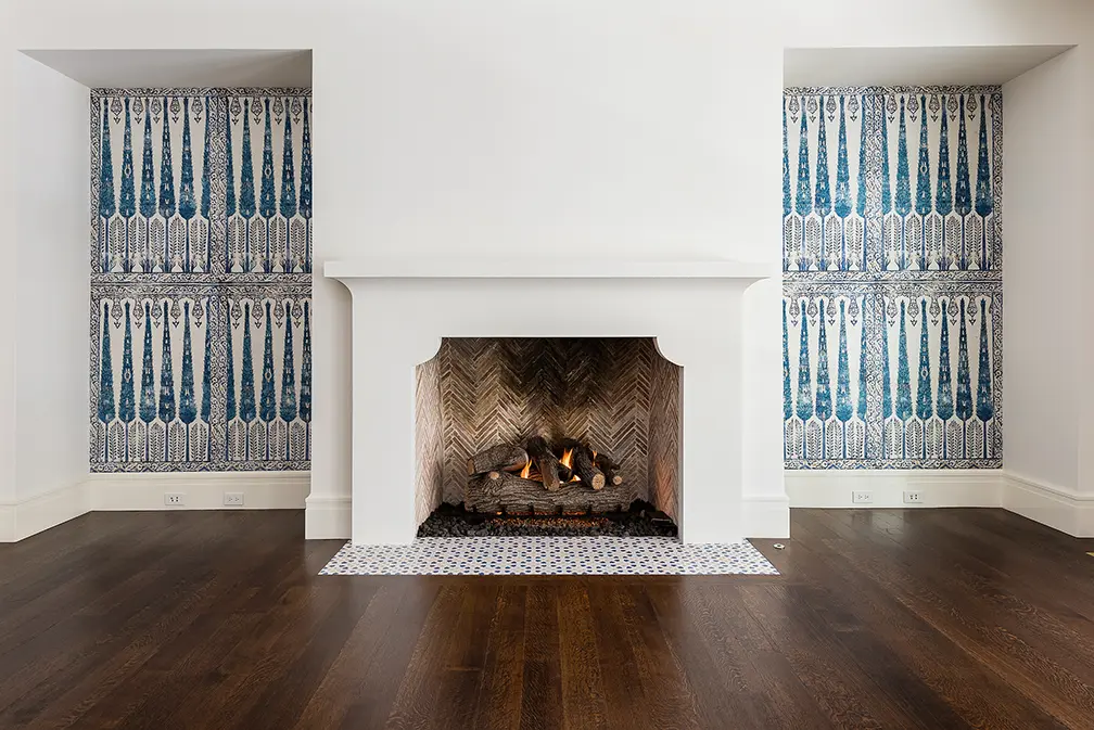 One of six elegant fireplaces in the thoughtfully redesigned home, located in Dallas' exclusive Volk Estates neighborhood. (Photo by Stephen Reed)