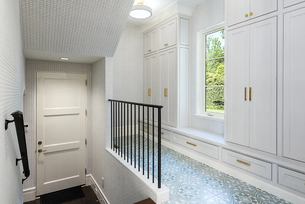 Pretty wallpaper and tile make their way the home's more unassuming places as well. (Photo by Stephen Reed)