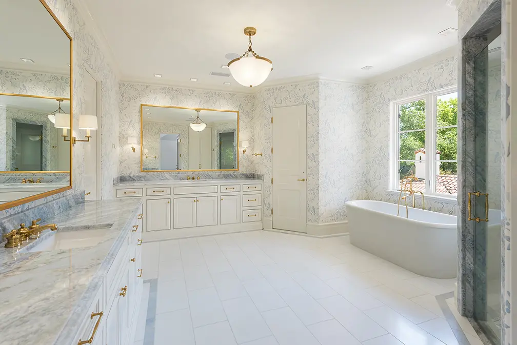 A marble and light filled master bath. (Photo by Stephen Reed)