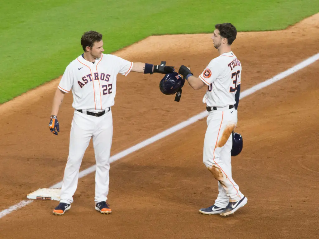 Josh Reddick and Kyle Tucker are linked by the right field battle — and each brings something different to the Astros. (Photo by F. Carter Smith)