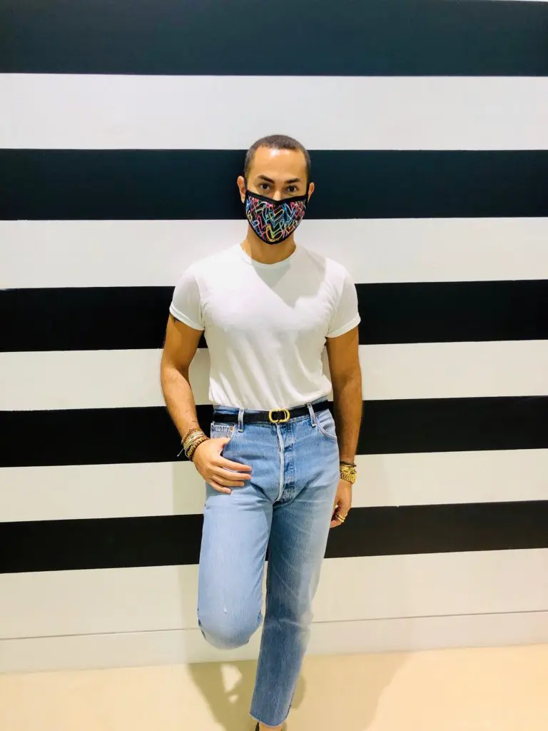 Fady Armanious dons a commissioned mask by artist James Goldcrown. (Courtesy photo)