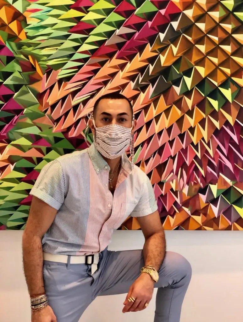 Fady Armanious leads the sartorial splendor of mask wearing during the pandemic, seen here in a Christy Lynn mask, carried by Tootsies. He has more than 20 in his collection. (Courtesy photo)