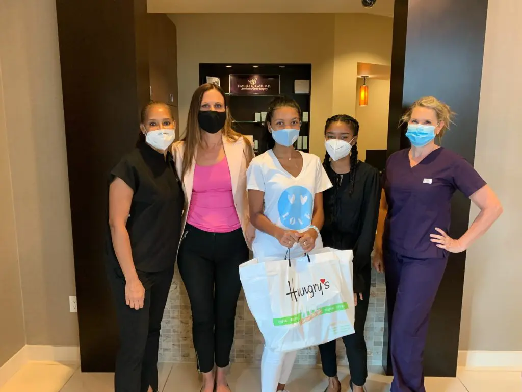 Gia McCrae brings lunch to essential workers  at Camille G. Cash, M.D.