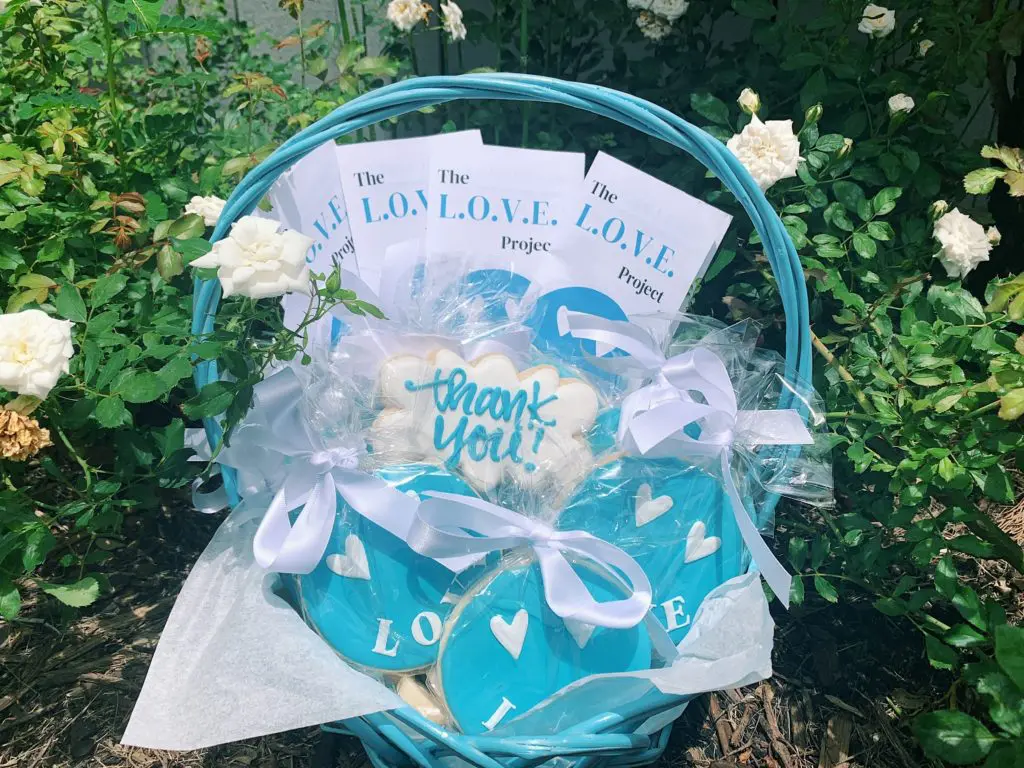 Gia McCrae's care package includes cookies from a local bakery, custom brochures, and stickers.