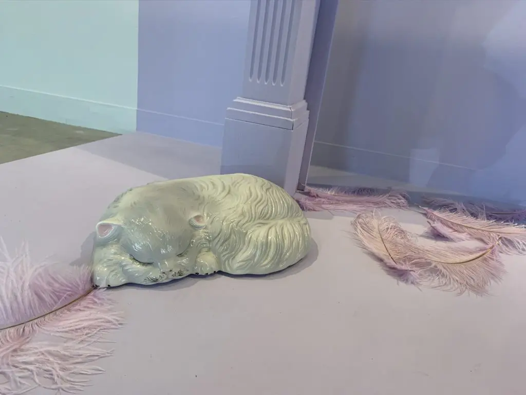The "Heights" installation, which represents a Victorian house in the Heights, includes a ceramic cat from the '70s.