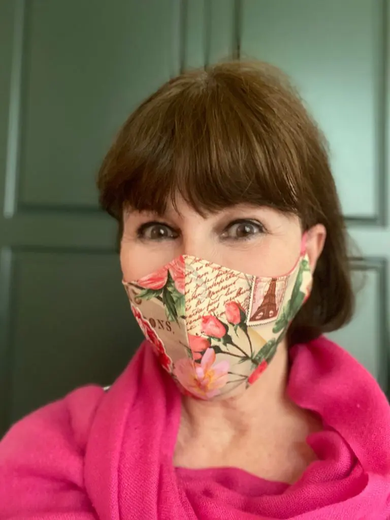 Shelby Hodge in a creative mask by artist Debra Linse, multiple layers, tight fit, fab fabric.