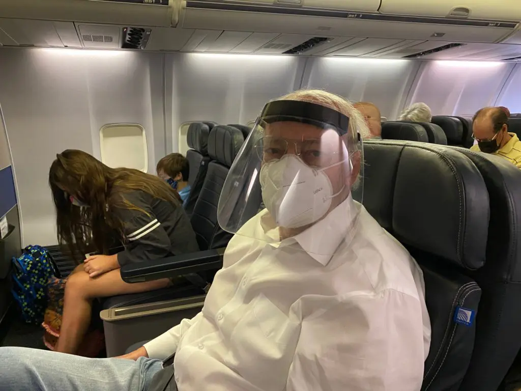 Shafik Rifaat is ready for travel on United Airlines with his KN95 mask, face shield, gloves and hand sanitizer. (Photo by Shelby Hodge)