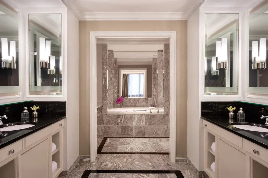 Your well-appointed bathroom equipped with a tub perfect for diving into your copy of "The Chiffon Trenches: A Memoir."