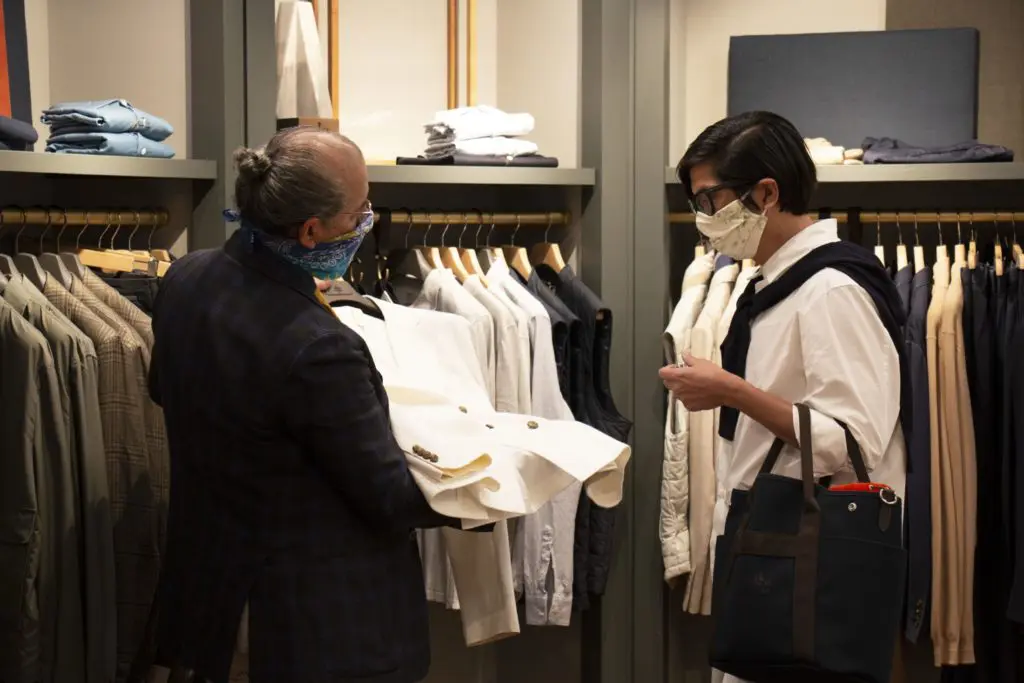 An Eleventy specialist showing current jacket options. (Photo by Zachary Trubenbach)