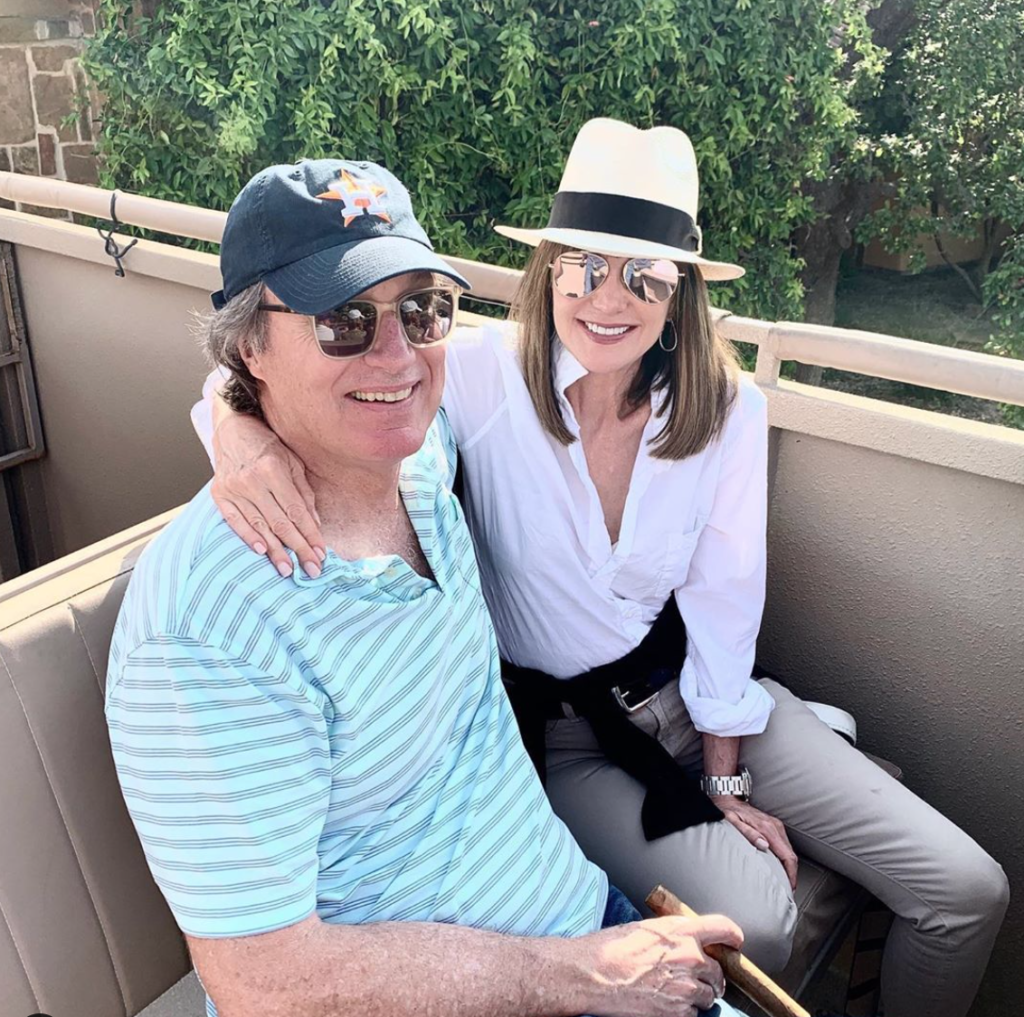Attorney and avid Astros fan Ron Franklin choses a team hat while the ever fashionable Janet Gurwitch, private equity partner with Advent International, wears a stylish fedora.
