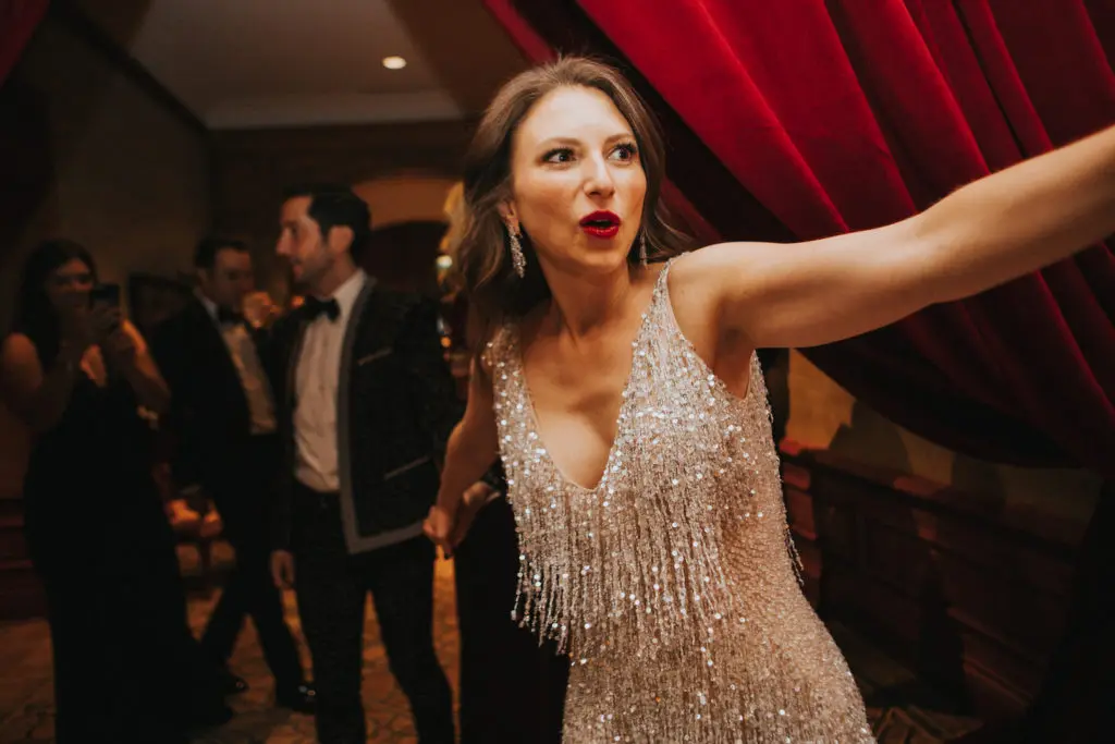 The bride changed into a Naeem Khan party dress. (Photo by Bowie Alexander)