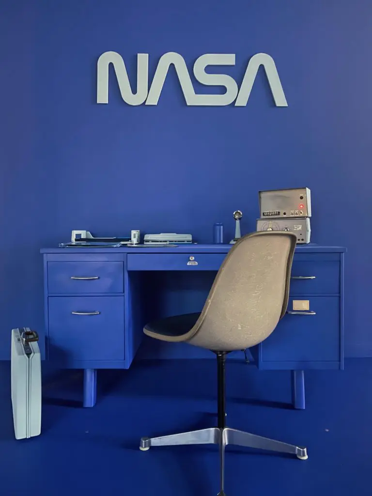 For "NASA," James Glassman's midnight-blue panel is paired with antiques from the '70s.
