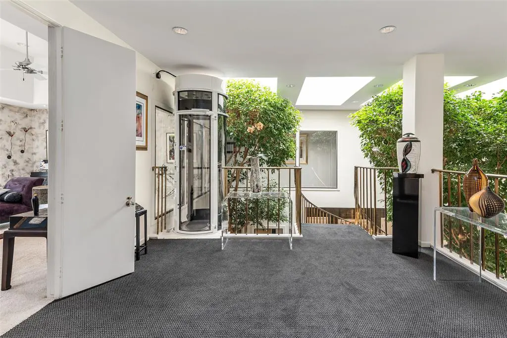 The second floor landing offers grand views down to the living/entertaining space.