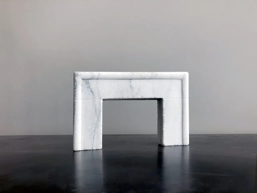 Sea Ranch fireplace in Vermont Danby marble with a French Quarter finish