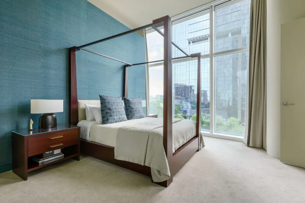 Main bedroom with grass cloth walls.