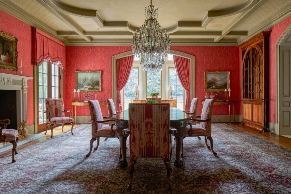 Walls of the formal dining room at 120 Carnarvon are upholstered in Fortuny fabric. (Photo by Nathan Schroder/Douglas Elliman)