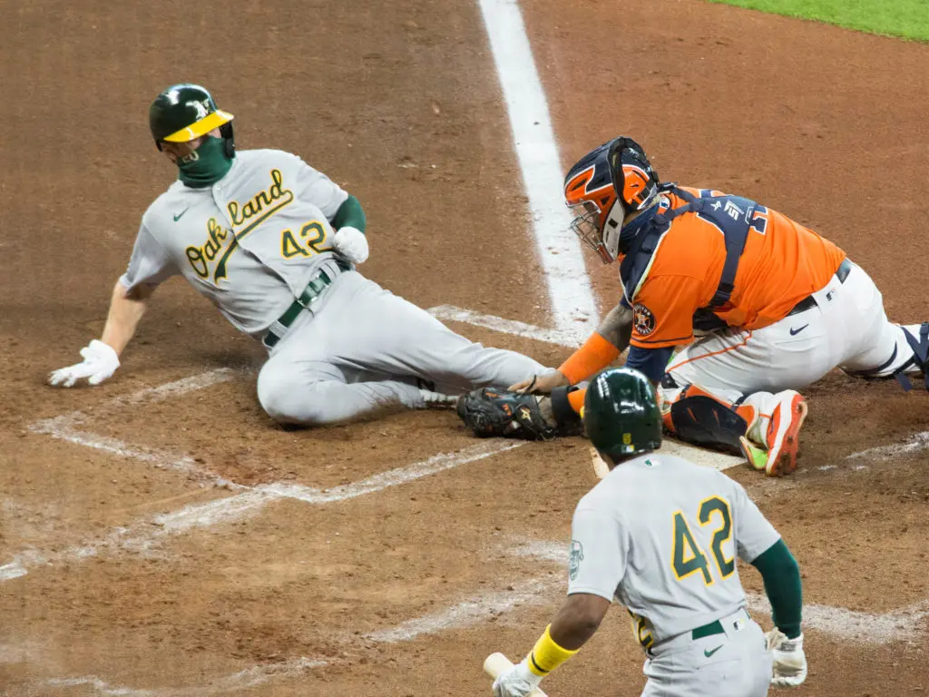 The A's runner was clearly out after a perfect Astros relay. (Photo by F. Carter Smith)