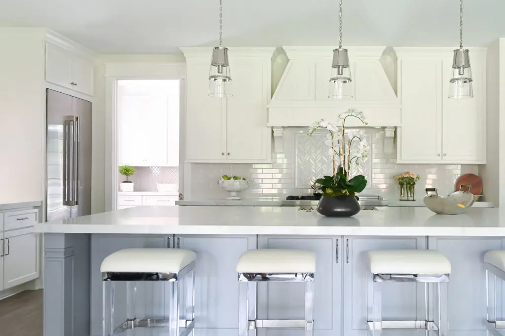 The bar stools in the kitchen come from the Chabonneau Studio Collection.