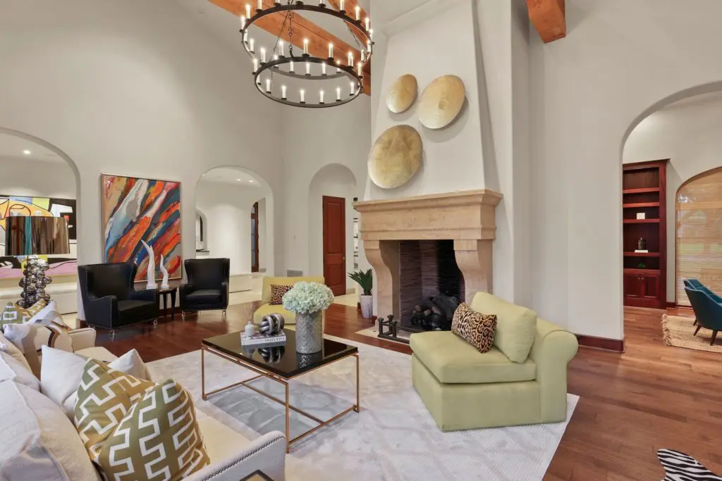 Vaulted ceilings rise in the living room.