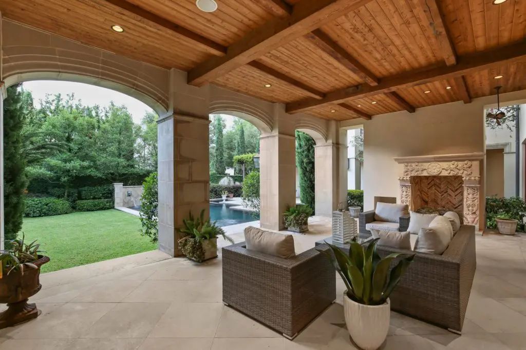 Relax in the outdoor room with focal point fireplace.
