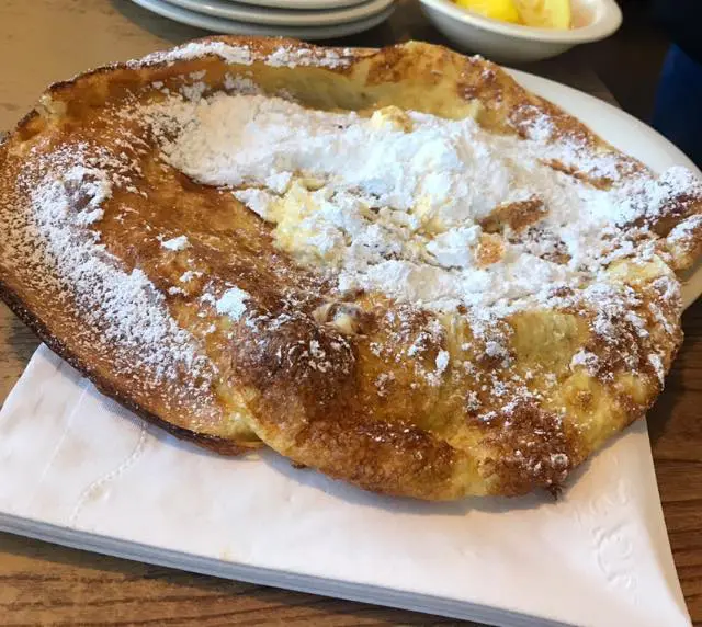 The famous German  pancake gets slathered with butter, lemon and powdered sugar.