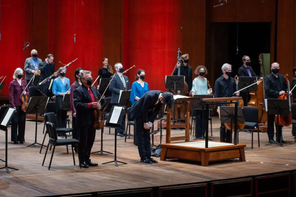 Houston Symphony musicians bow to the standing ovation as they complete their "Live From Jones Hall" concert. (Photo by Wilson Parish)