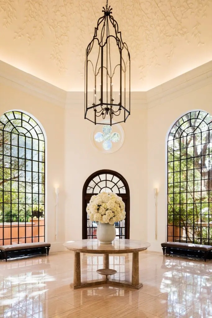 The Mansion's hand-carved plaster rotunda created by Casci Ornamental Plaster. Thomas Pheasant designed the light fixture and marble table. 