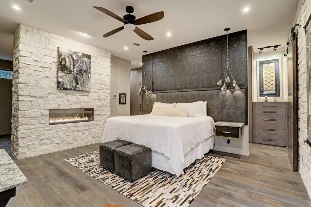 This first-floor master suite has a custom floating wall/headboard adorned in faux elephant hide. 
