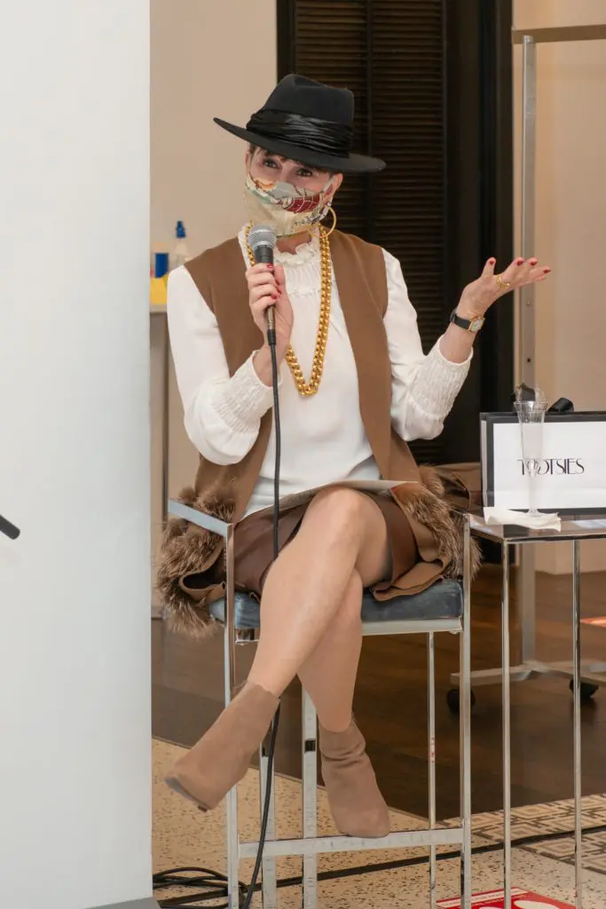 Shelby Hodge snares the Eugenia Kim hat right from the model's head. (Photo by Jacob Power)