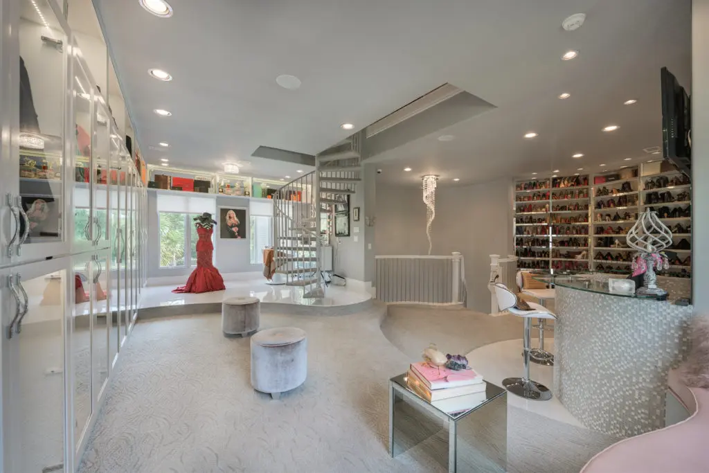 A $10,000 designer gown gracing  a mannequin is a focal point of one of the three floors of the closet.